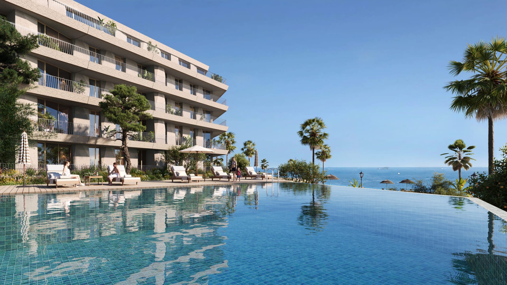 The infinity pool, with one of the buildings behind it and the sea to one side. Vesta Mare, La Duquesa, Manilva.