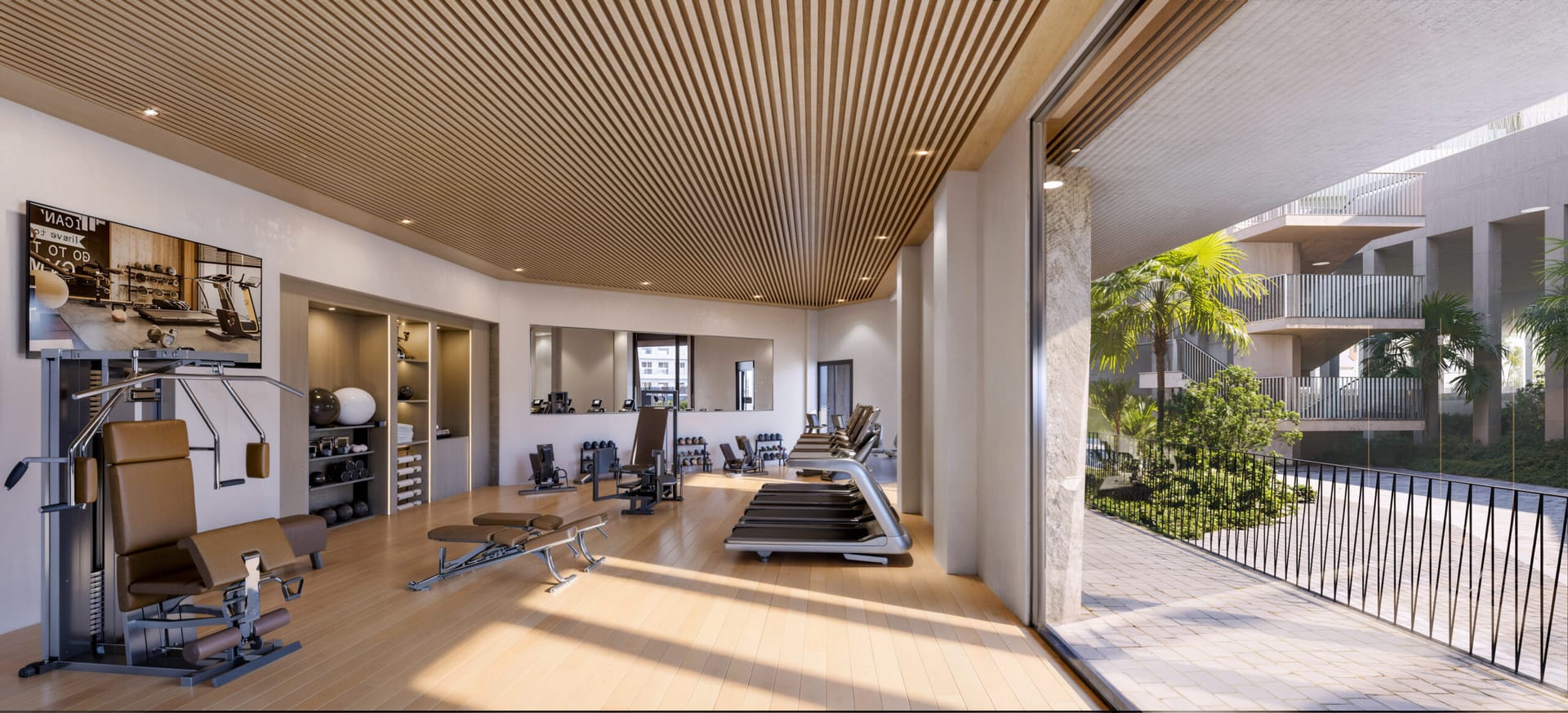 The gym, with a wall of glass onto a terrace. Vesta Mare, La Duquesa, Manilva.