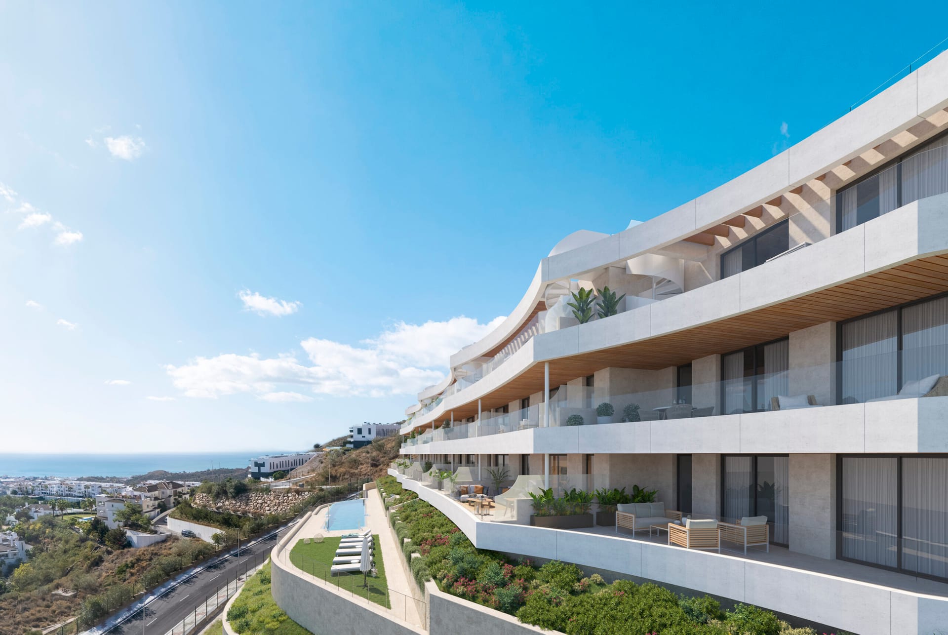 The terraces along the sea-facing side, with the planted gardens and the pool below them and the sea in the distance. Victoria Hills, Torre de Benagalbón, Rincón de la Victoria.