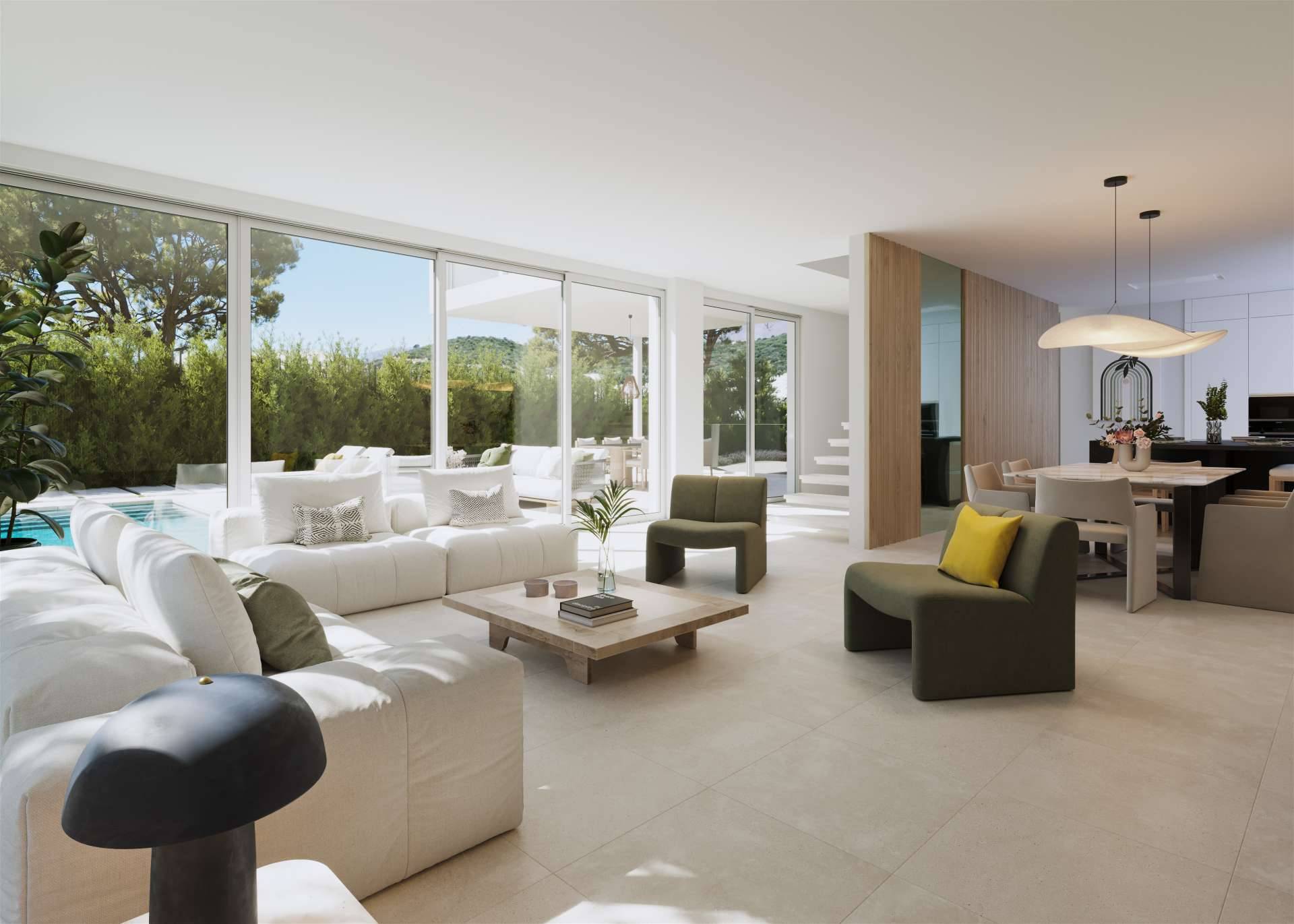The living room, with sliding glass walls onto the garden and the pool, and the dining area and kitchen beyond. Villas Monte Palatino, Valle Romano, Estepona.