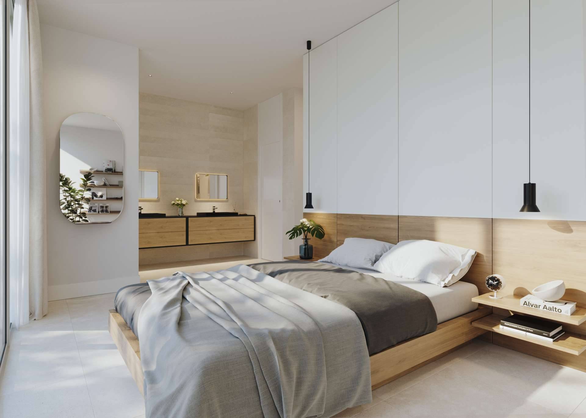 A bedroom with a timber headboard wall and pendant lights, and its bathroom with two basins behind. Villas Monte Palatino, Valle Romano, Estepona.