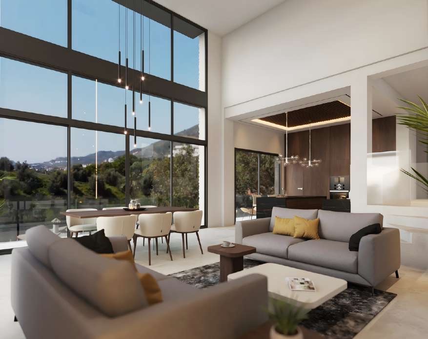 The living room in one of the illustrations of the finished villa, with a glass wall rising through two floors and the kitchen behind. Vistamar Acapulco, Añoreta Golf, Rincón de la Victoria.