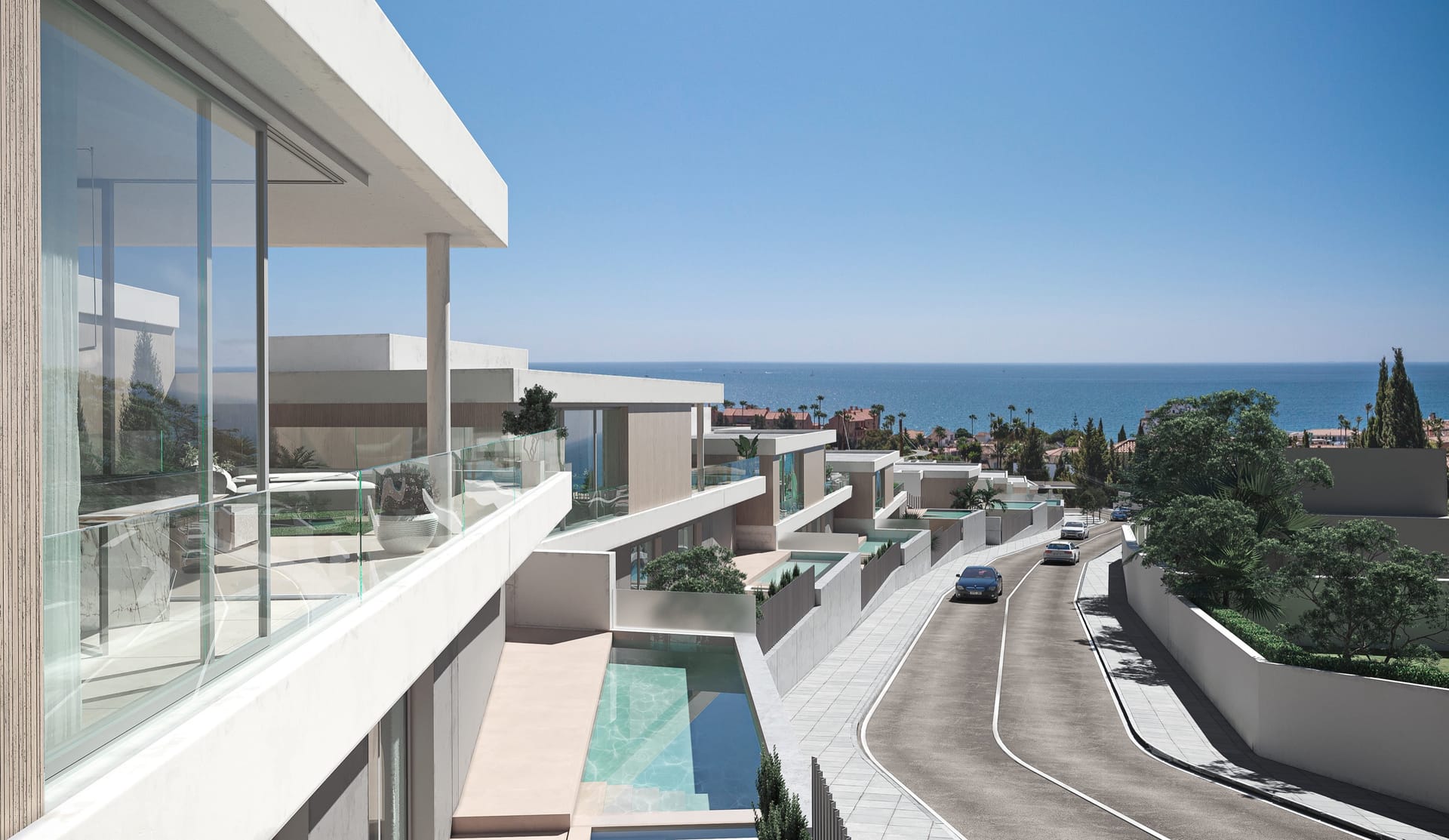 The view from an upper terrace down the line of villas and their pools to the sea. Zenity Cyan, La Gaspara, Estepona.