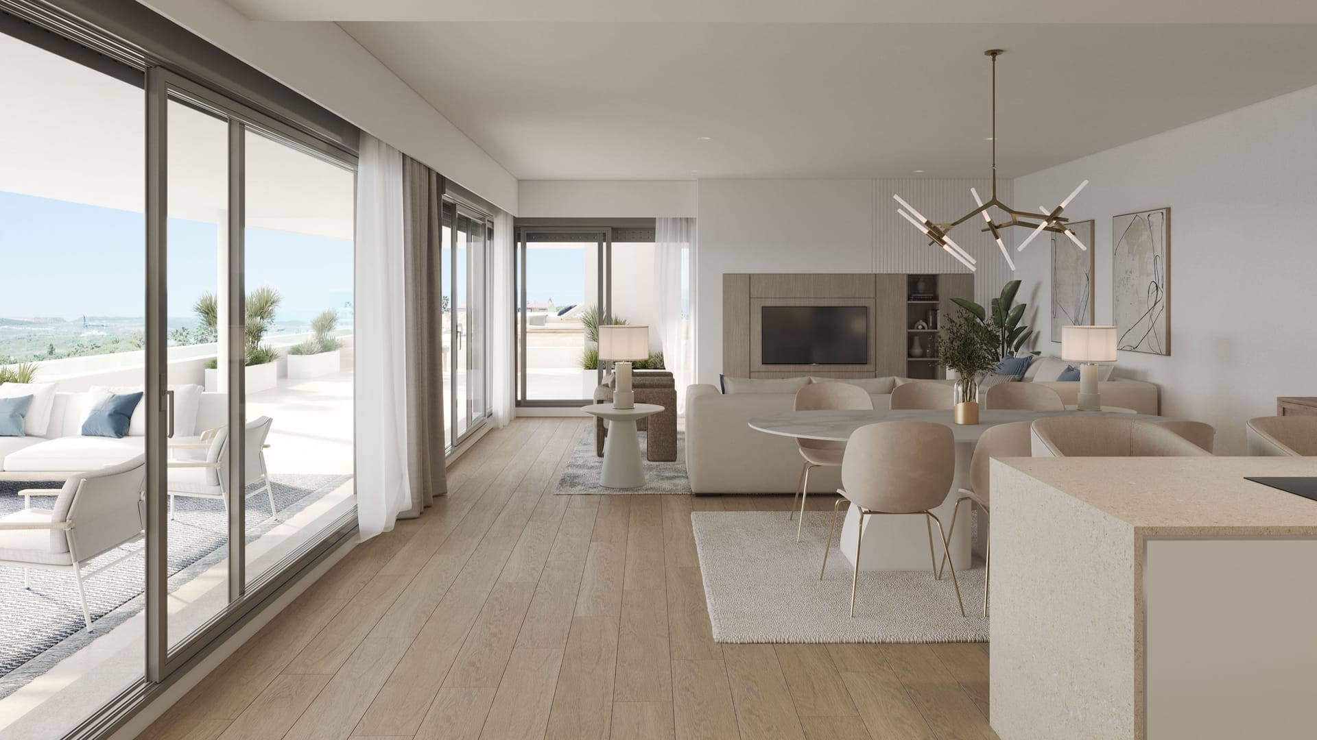 A living and dining room with sliding glass doors along one side, open to a terrace with outdoor sofas. Zenity Indigo, La Gaspara, Estepona.