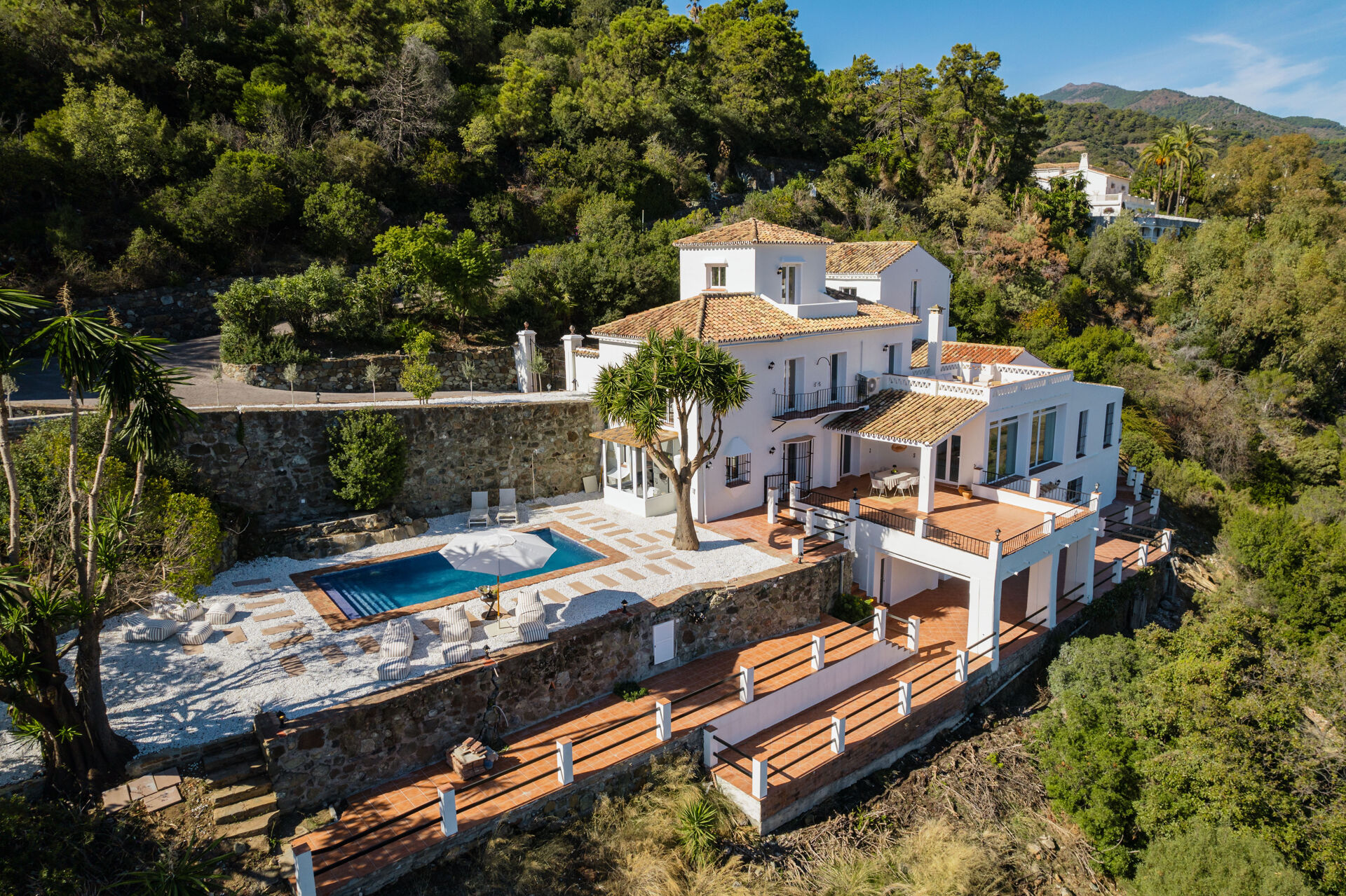 Villa Esencia, El Madroñal, Benahavís, with its garden and pool